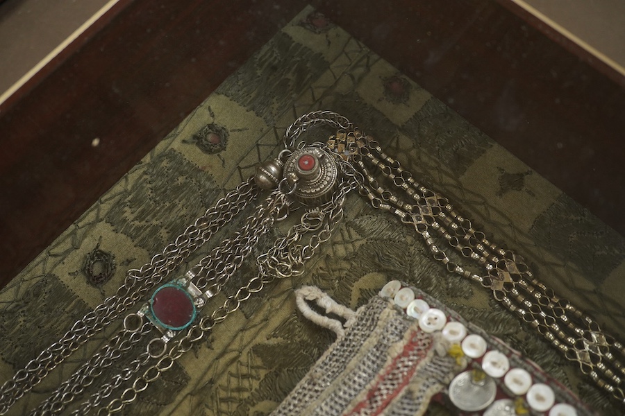 A framed Omani tribe wedding veil, 45 x 62cm. Condition - good